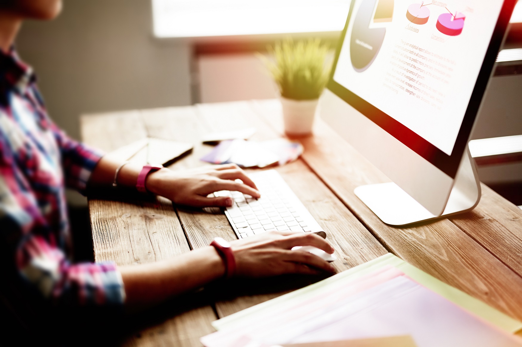 Image of person sitting in front of computer screen