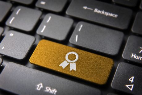 business key with ribbon icon on laptop keyboard
