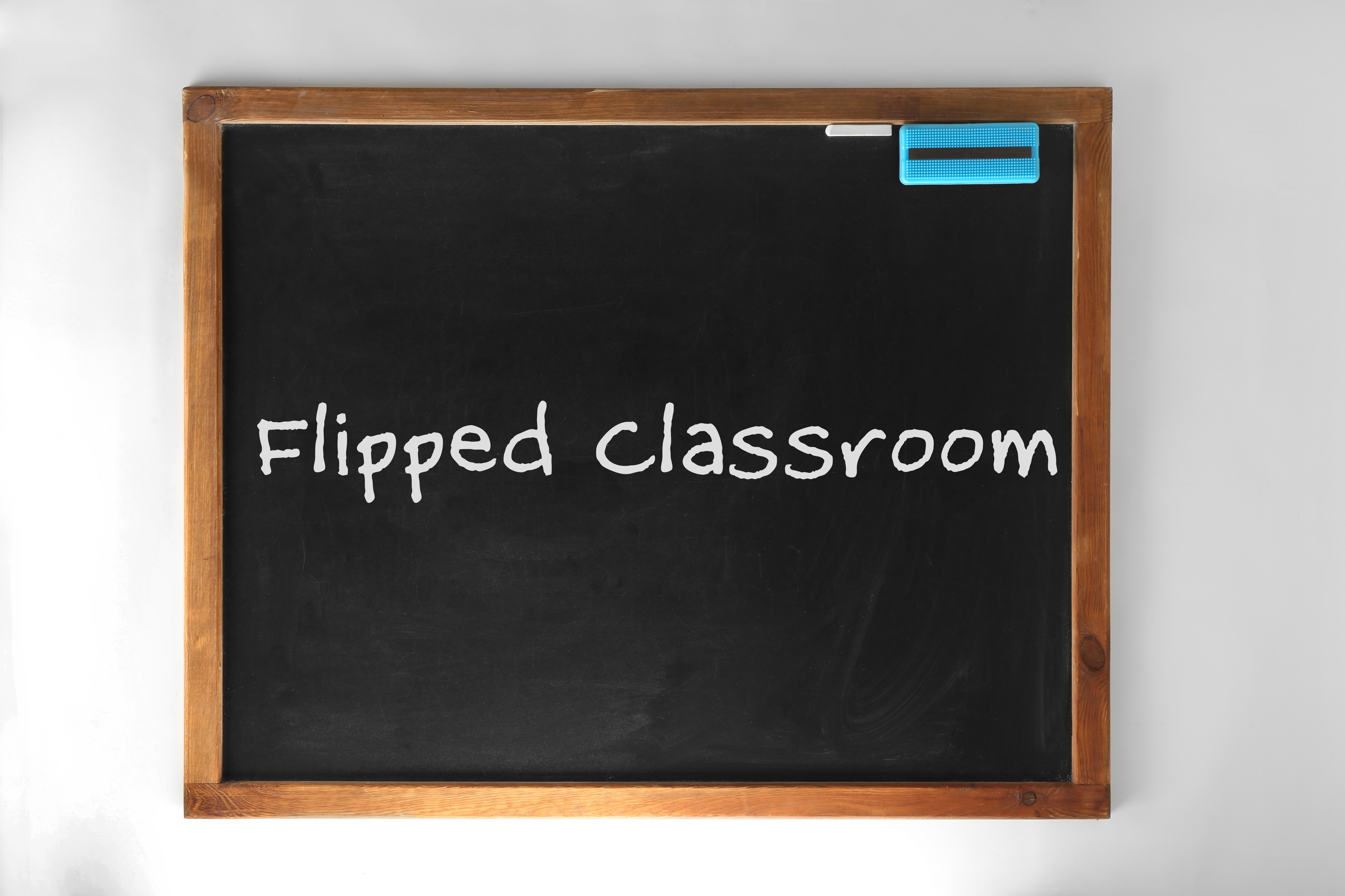 Flipped classroom concept. Inversed blackboard on white background