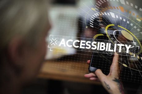 Woman using smart phone with accessibility word graphic popup